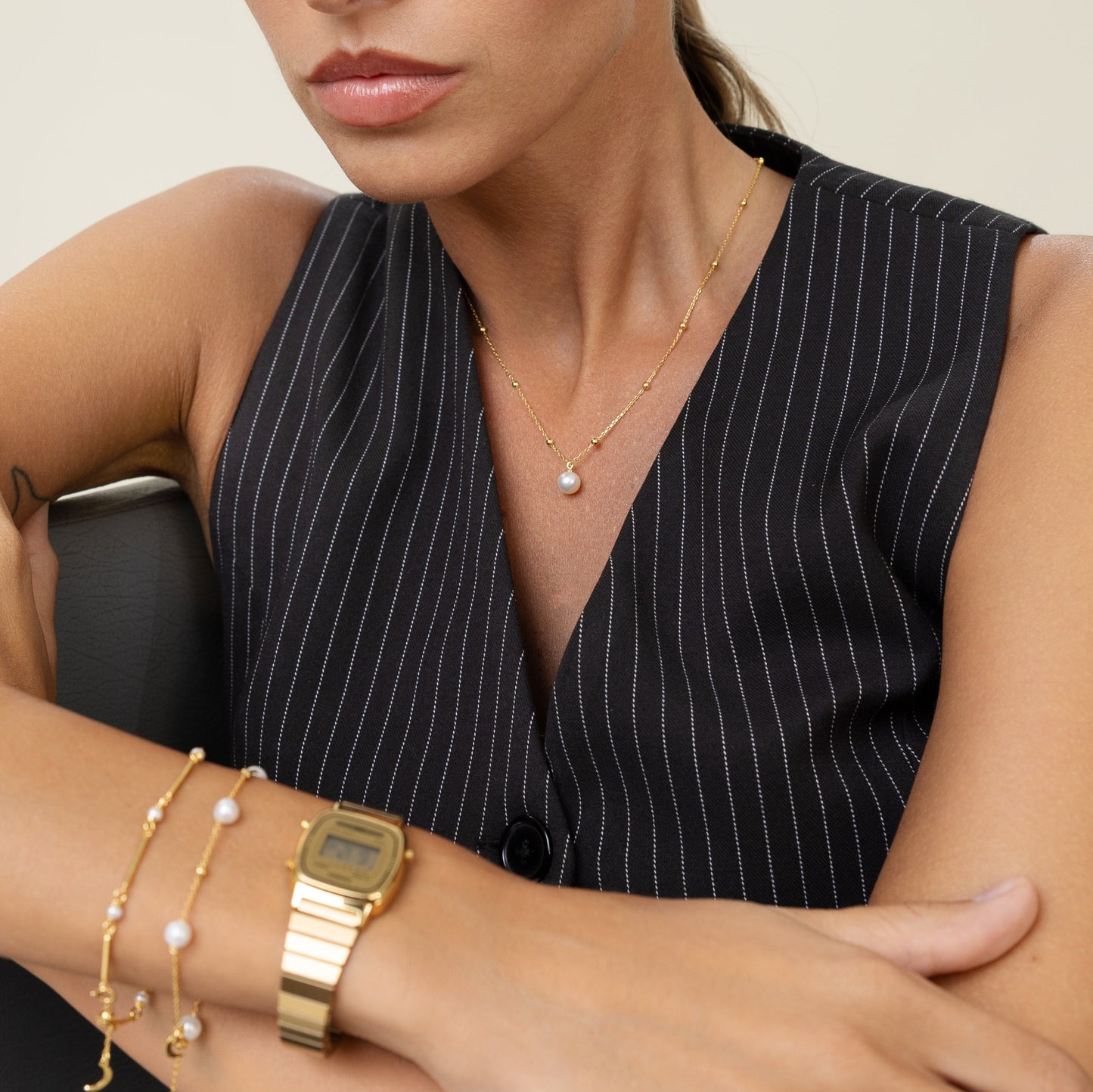 Pearl necklace with gold beads and gold chain. Affordable luxury