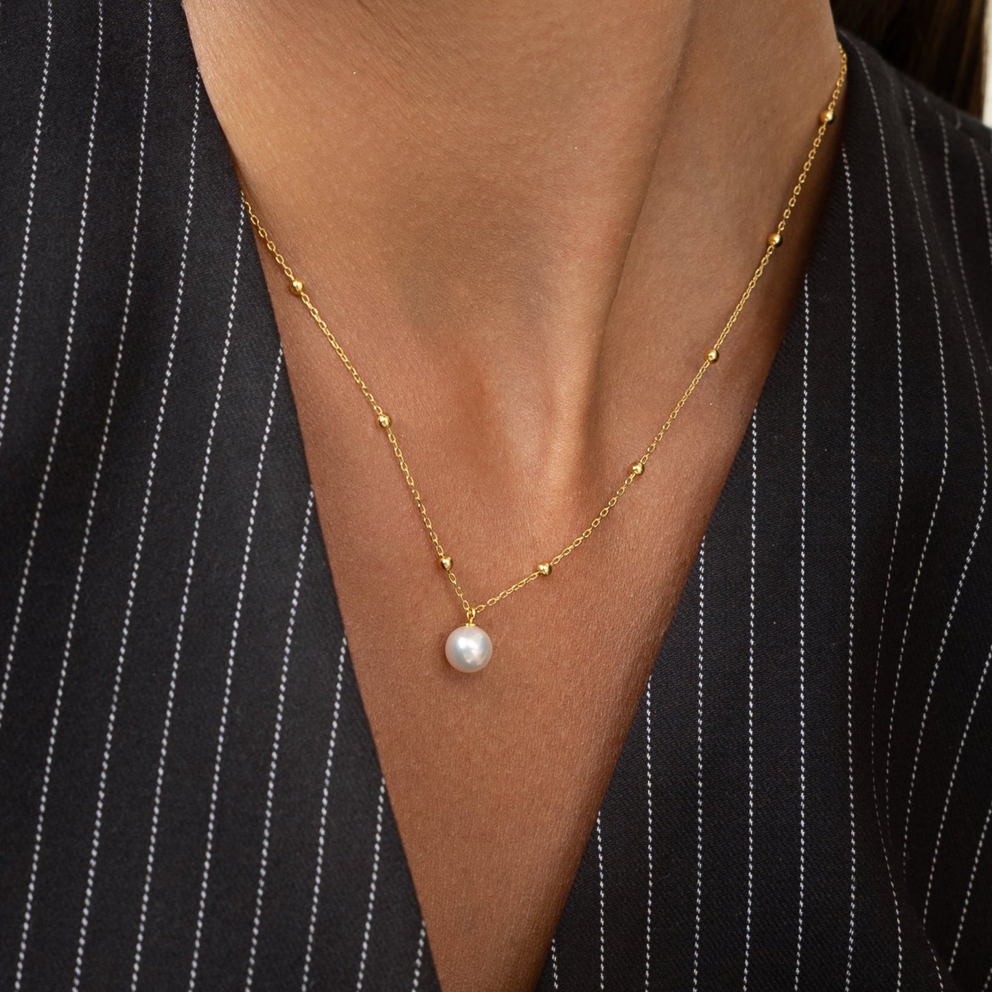 Pearl necklace with gold beads. Perfect for the office or anywhere else