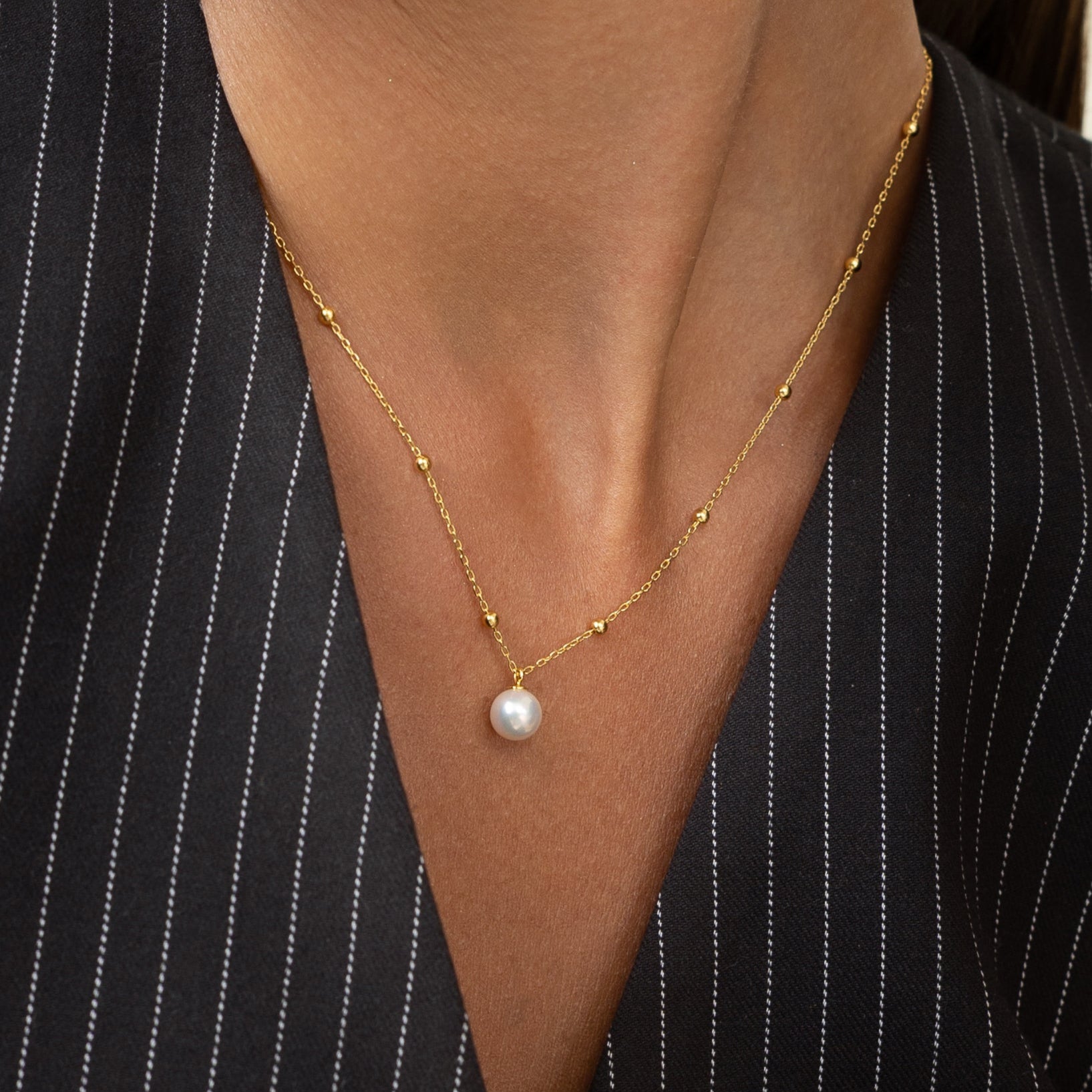Pearl necklace with gold beads. Perfect for the office or anywhere else