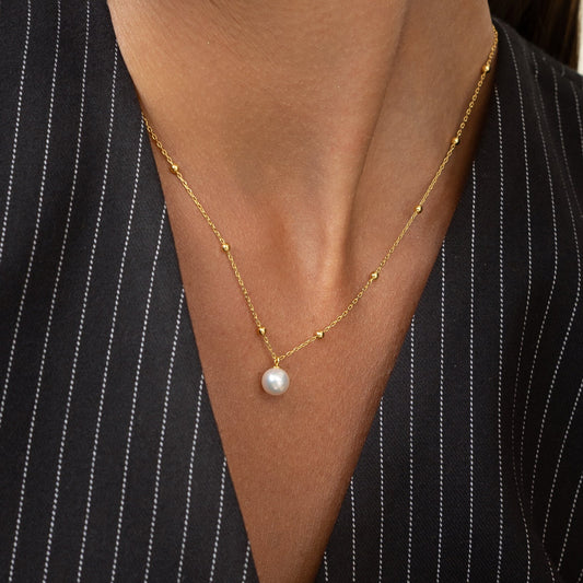 Pearl necklace with gold beads. Perfect for the office or anywhere else
