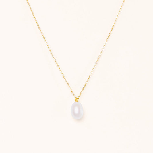 Simple elegant necklace with a teardrop pearl hanging from a gold chain