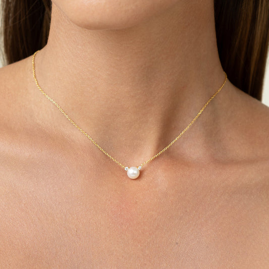 diamond necklace with pearl and gold chain
