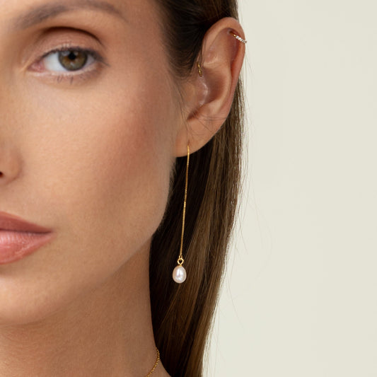 Threader earrings featuring teardrop freshwater pearls suspended on delicate 18k gold-plated 925 silver chains