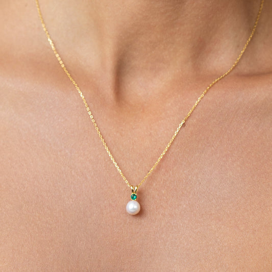 Pearl Pendant with Emerald on a gold adjustable chain.