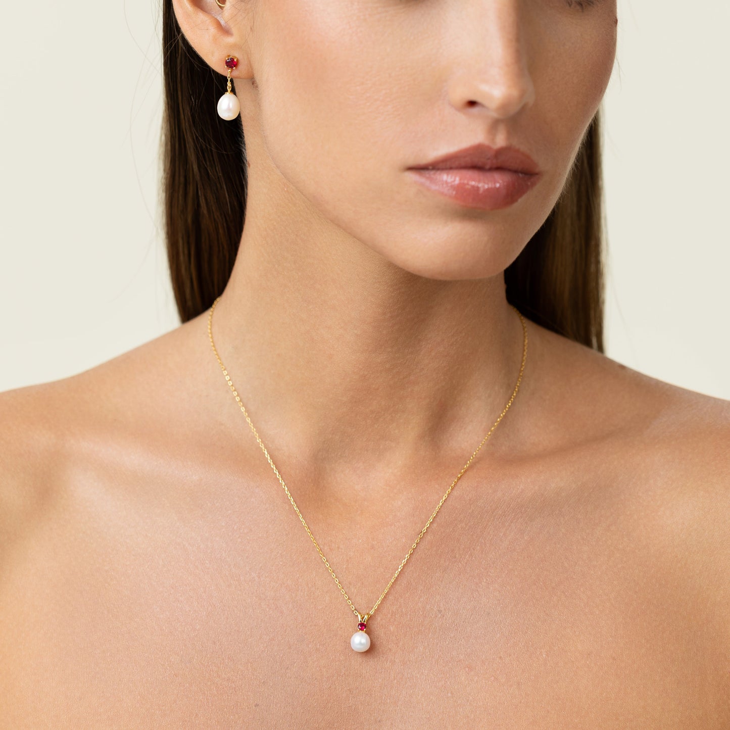 Beautiful vibrant red ruby on a pendant. With a golden adjustable chain