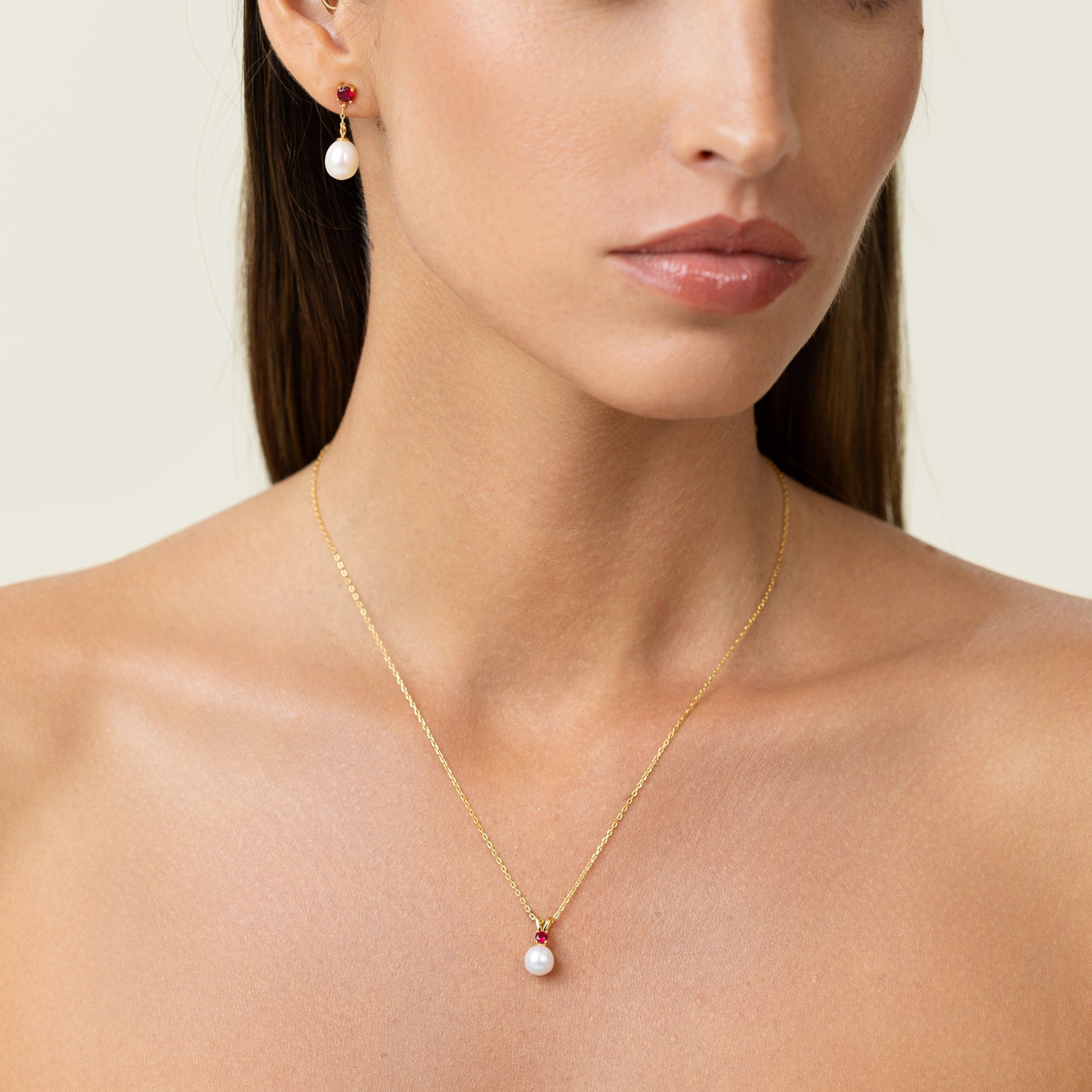 Beautiful vibrant red ruby on a pendant. With a golden adjustable chain