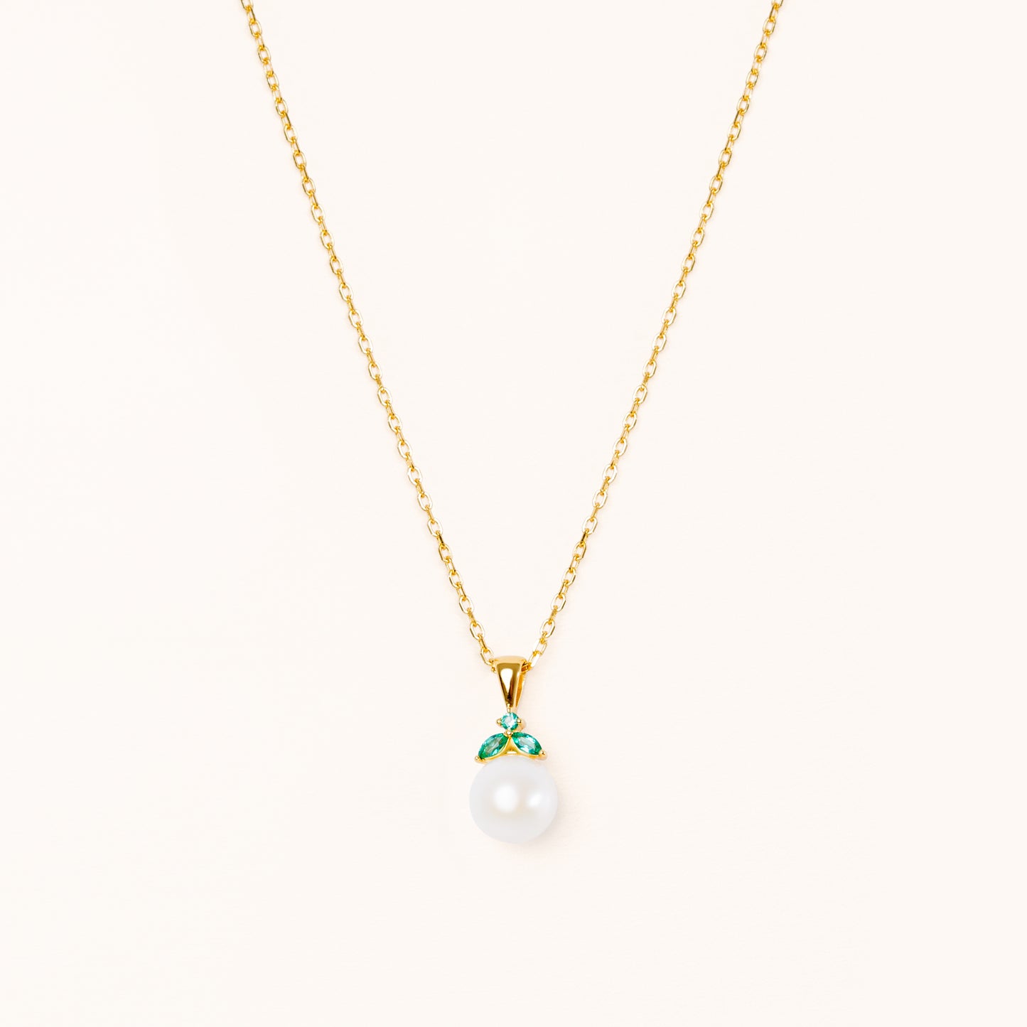 Emerald and pearl gold pendant. Shaped like a cute fruit.