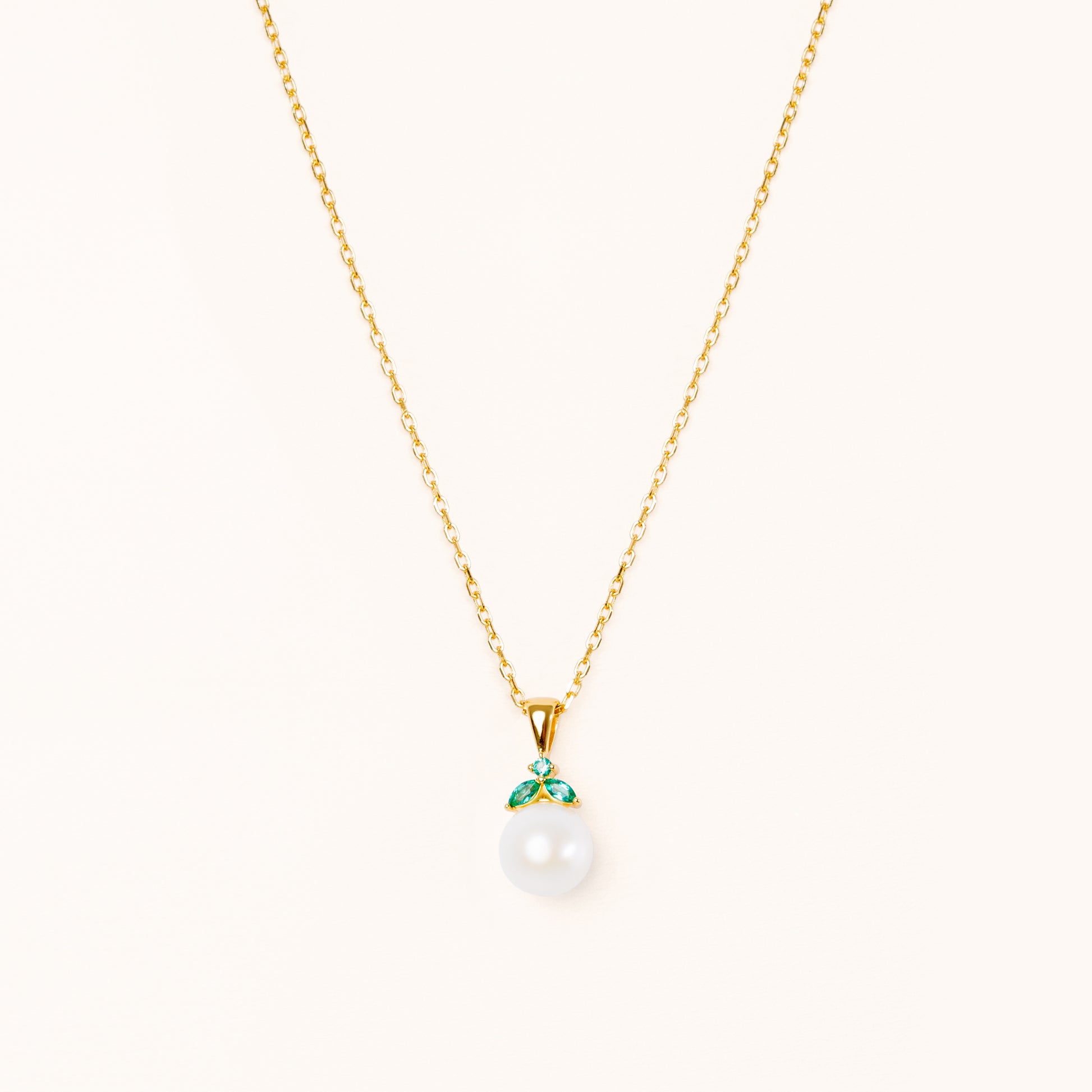 Emerald and pearl gold pendant. Shaped like a cute fruit.