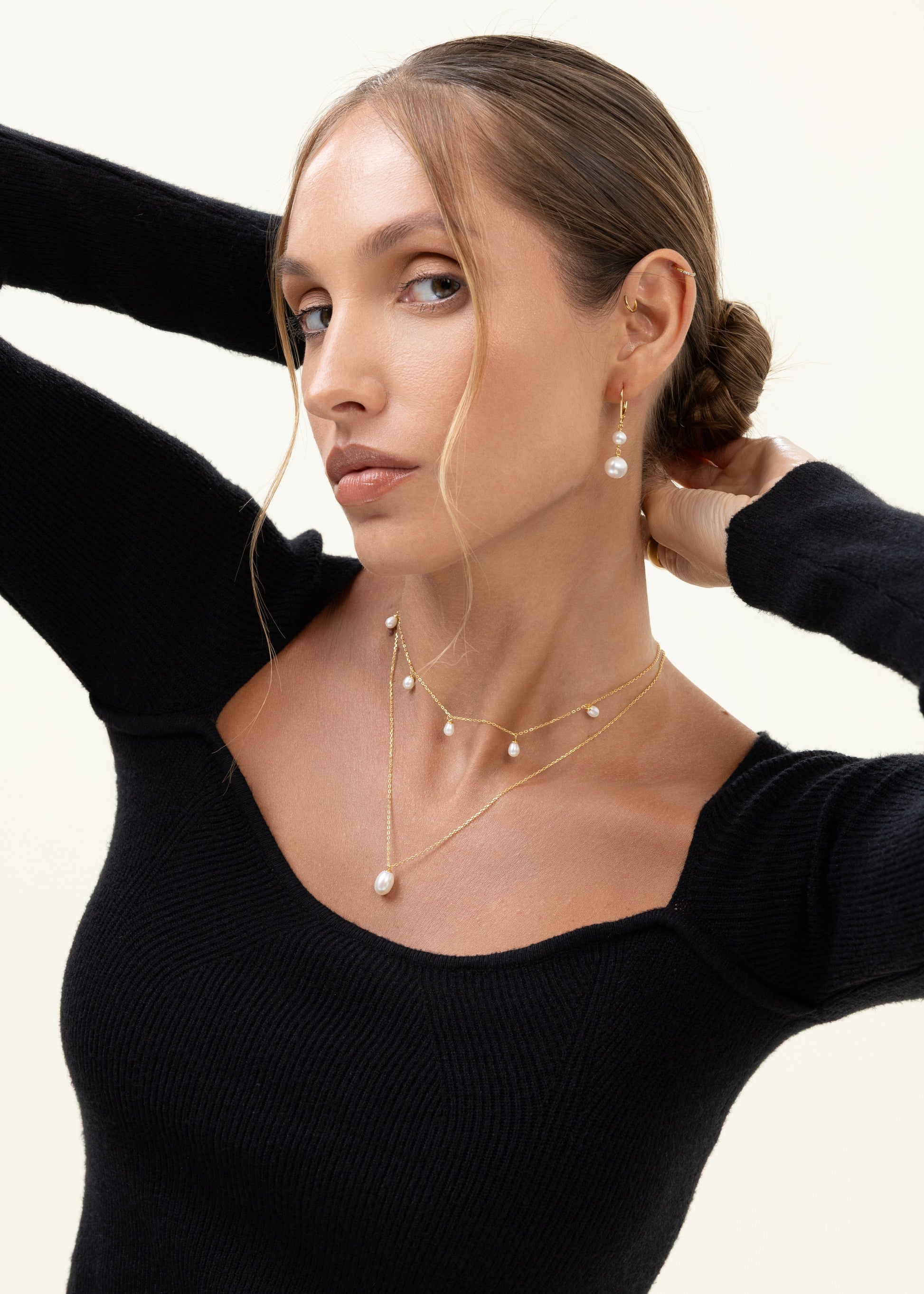 Pearl drop necklace with 5 dangling pearls from a gold chain. Adjustable, can be worn as a choker