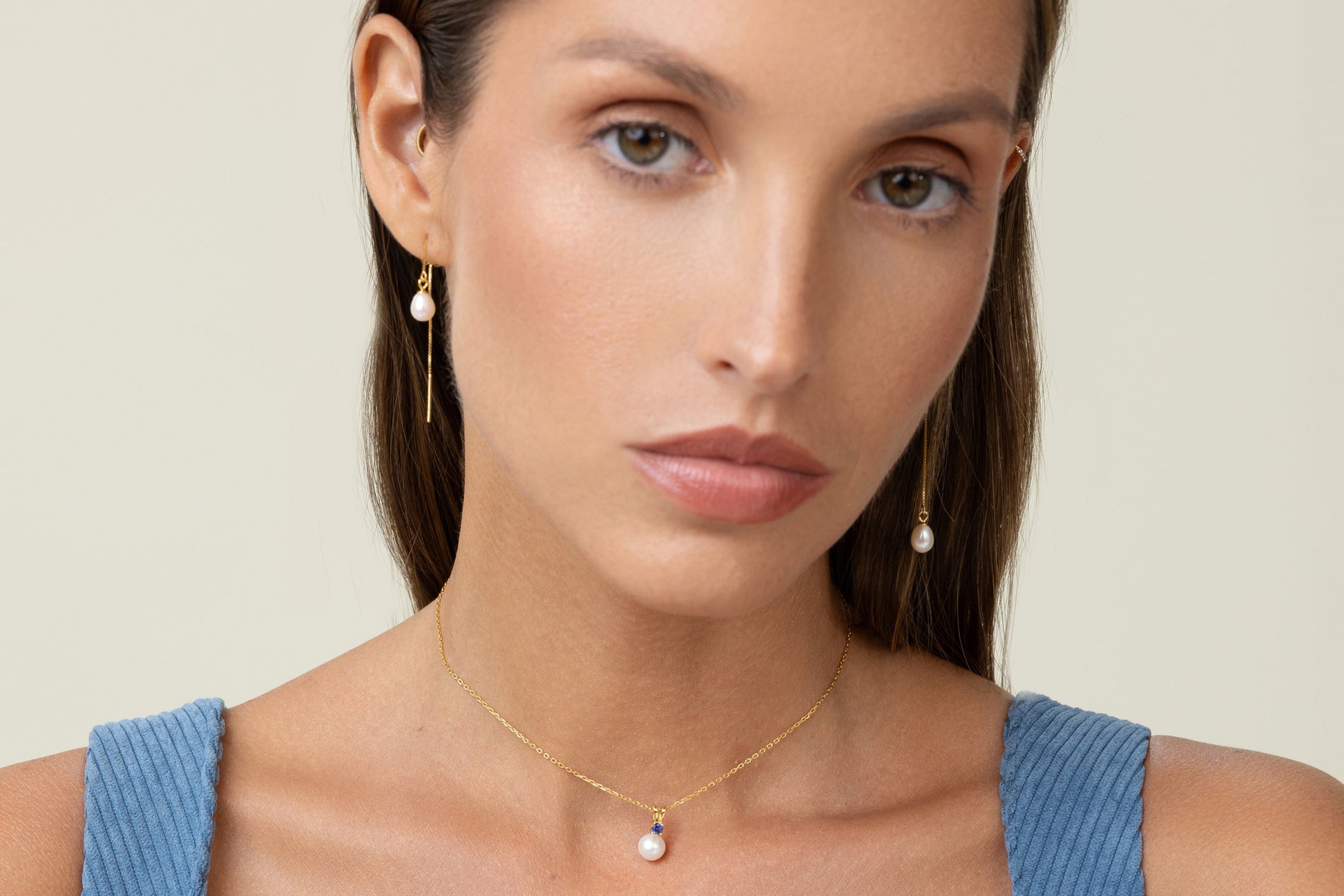 Threader earrings featuring teardrop freshwater pearls suspended on delicate 18k gold-plated 925 silver chains