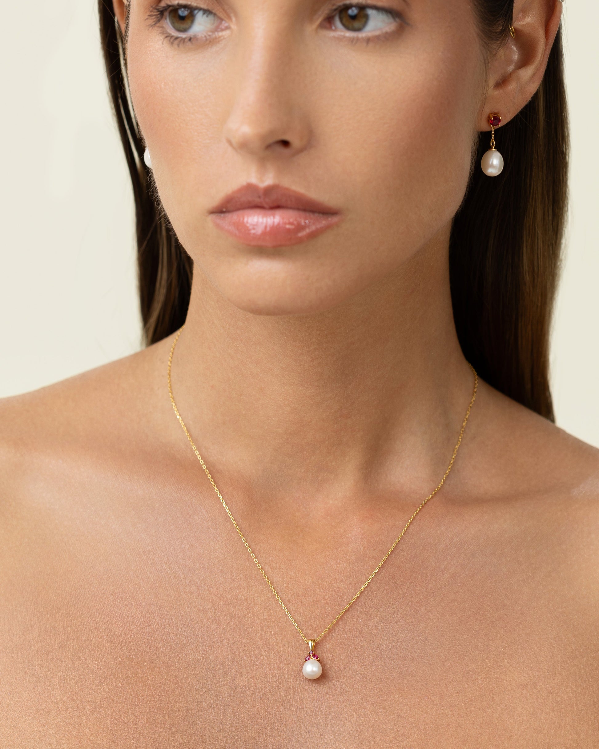 Pearl pendant with red rubies. Shaped like a beautiful fruit. Can be worn as choker or long.