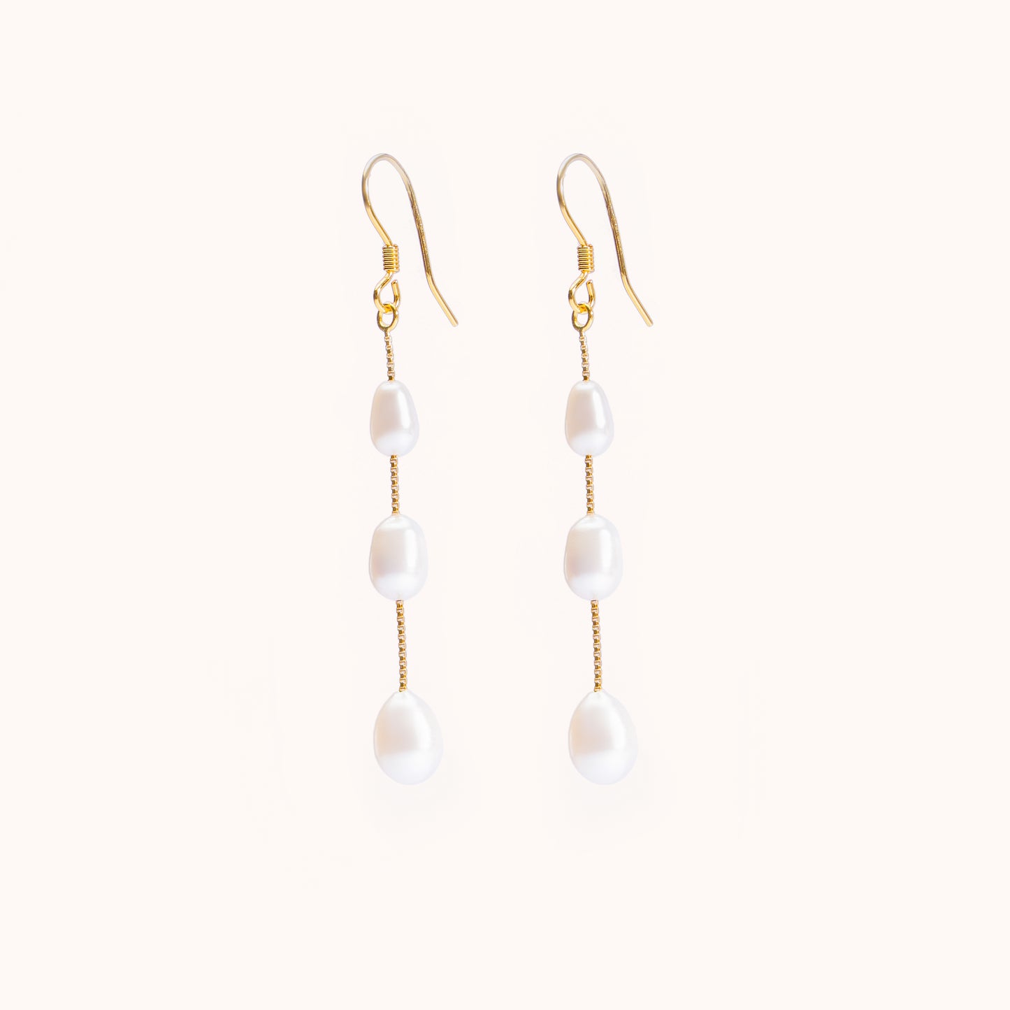 3 pearls dangling from a gold chain. Beautiful earrings
