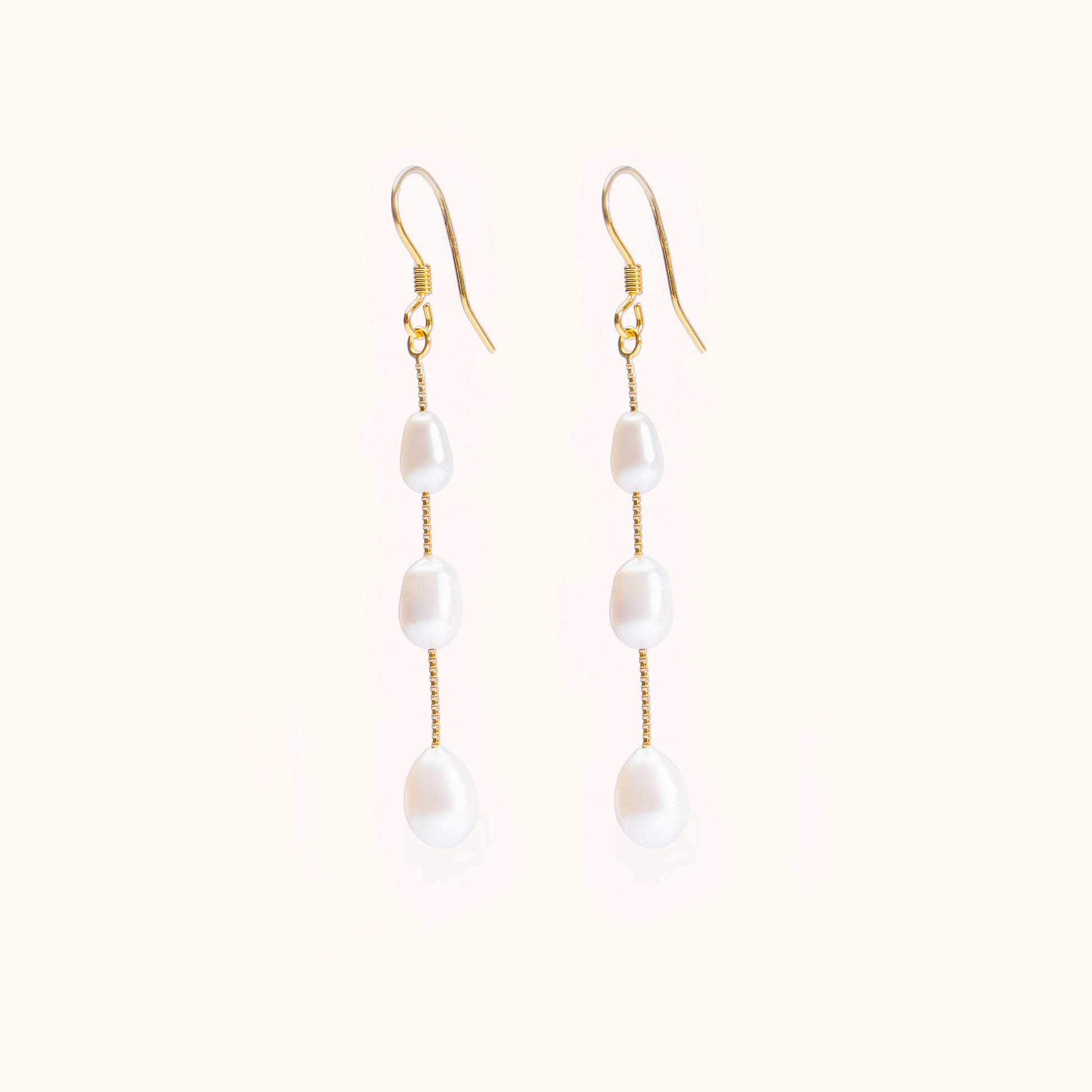 3 pearls dangling from a gold chain. Beautiful earrings