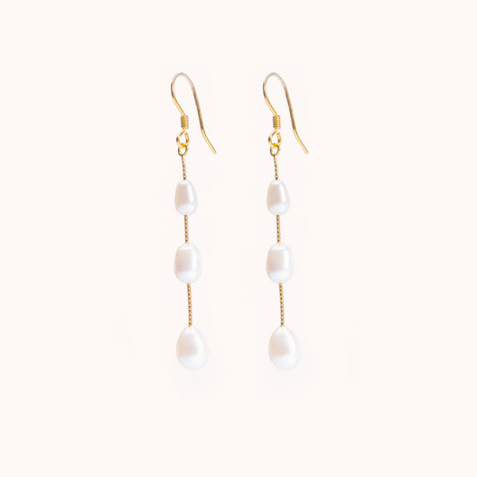 3 pearls dangling from a gold chain. Beautiful earrings