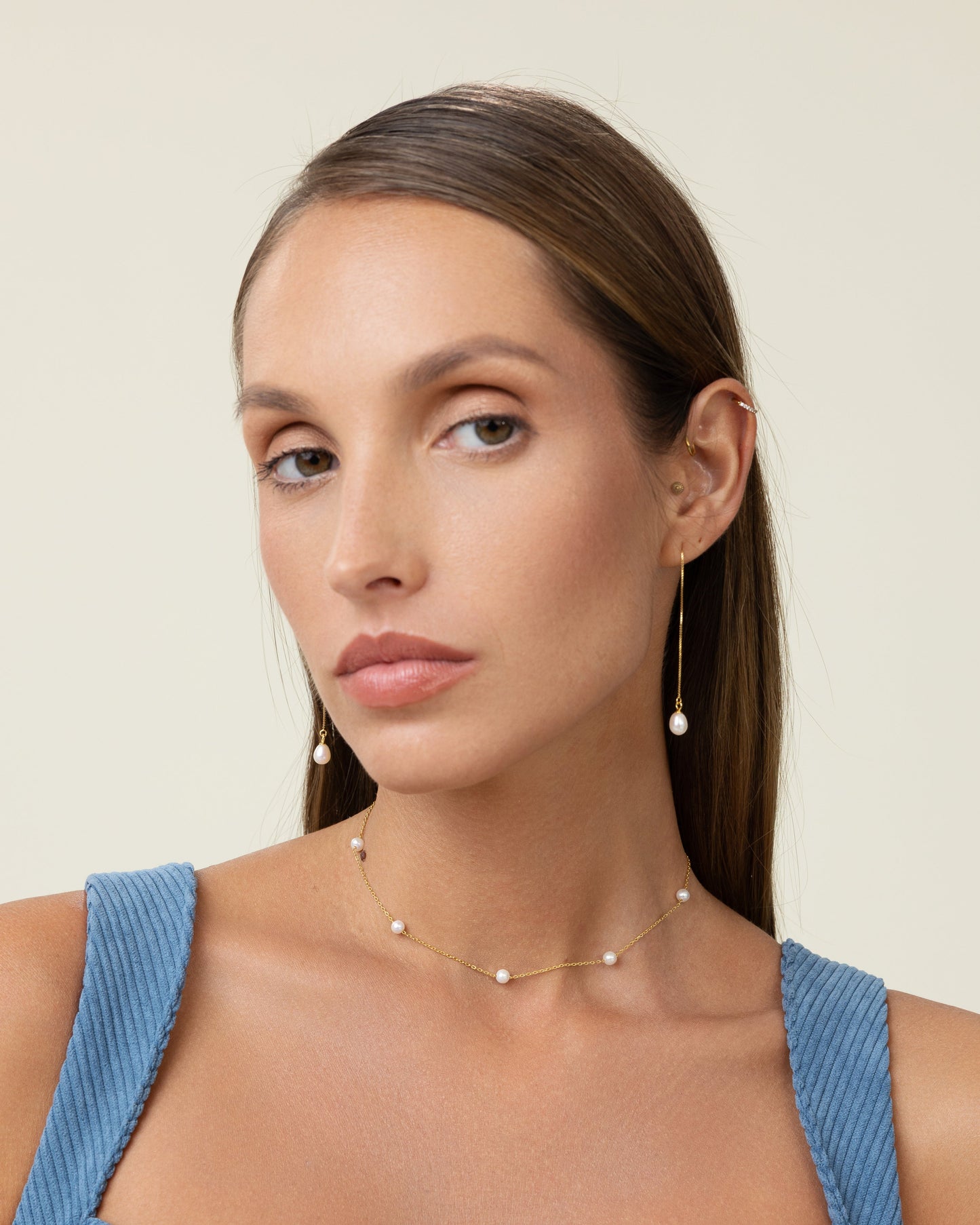 Round pearl chain can be worn short or long, with freshwater pearls on a gold chain