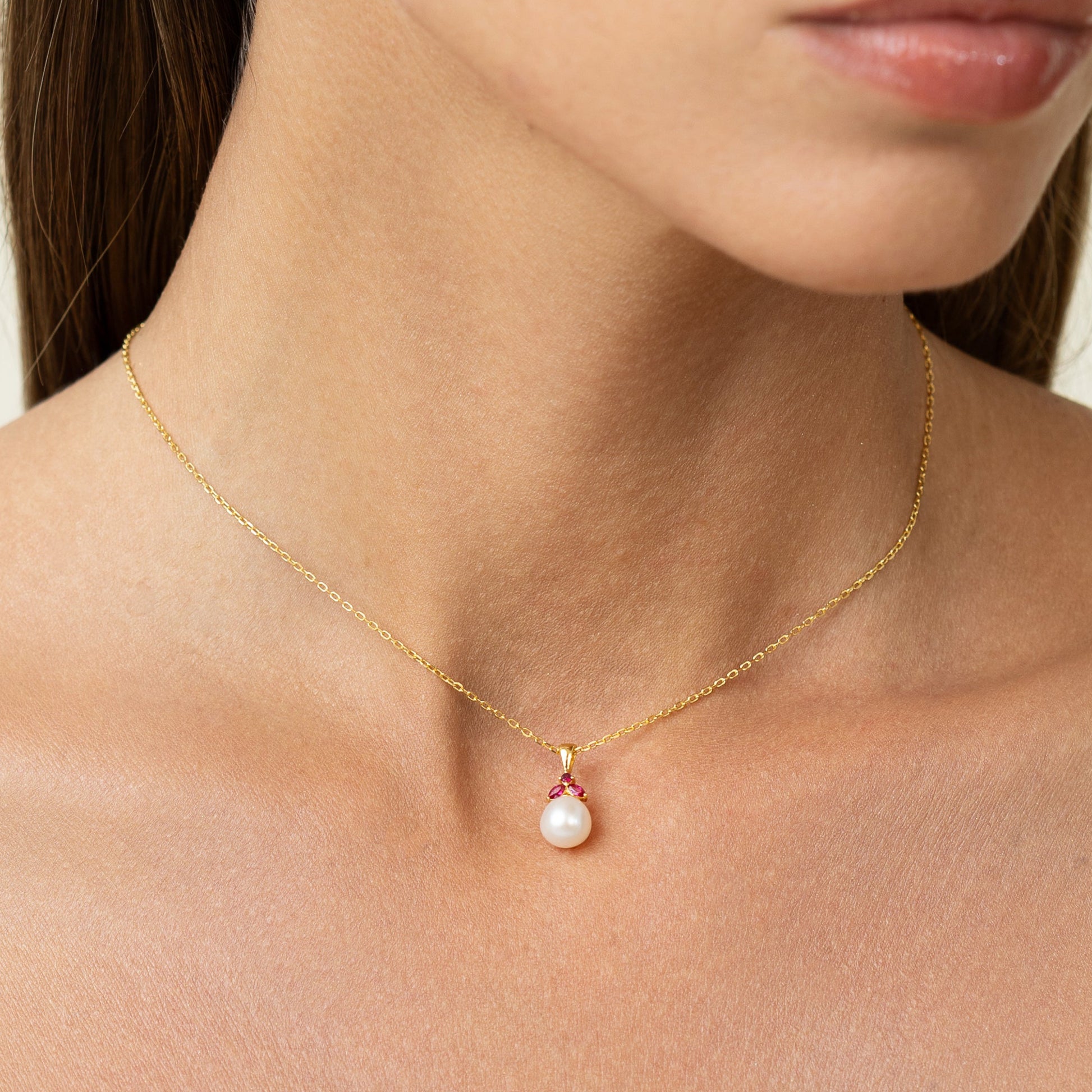Pearl pendant with red rubies. Shaped like a beautiful fruit. Can be worn as choker or long.