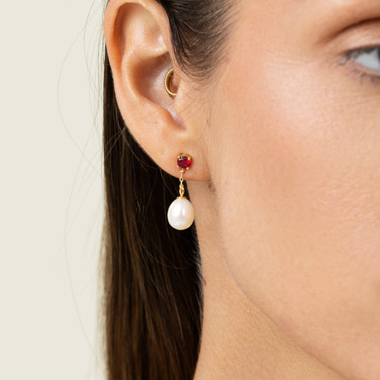 Drop earring featuring a round lab-grown ruby stud and an oval freshwater pearl on 18k gold-plated 925 silver