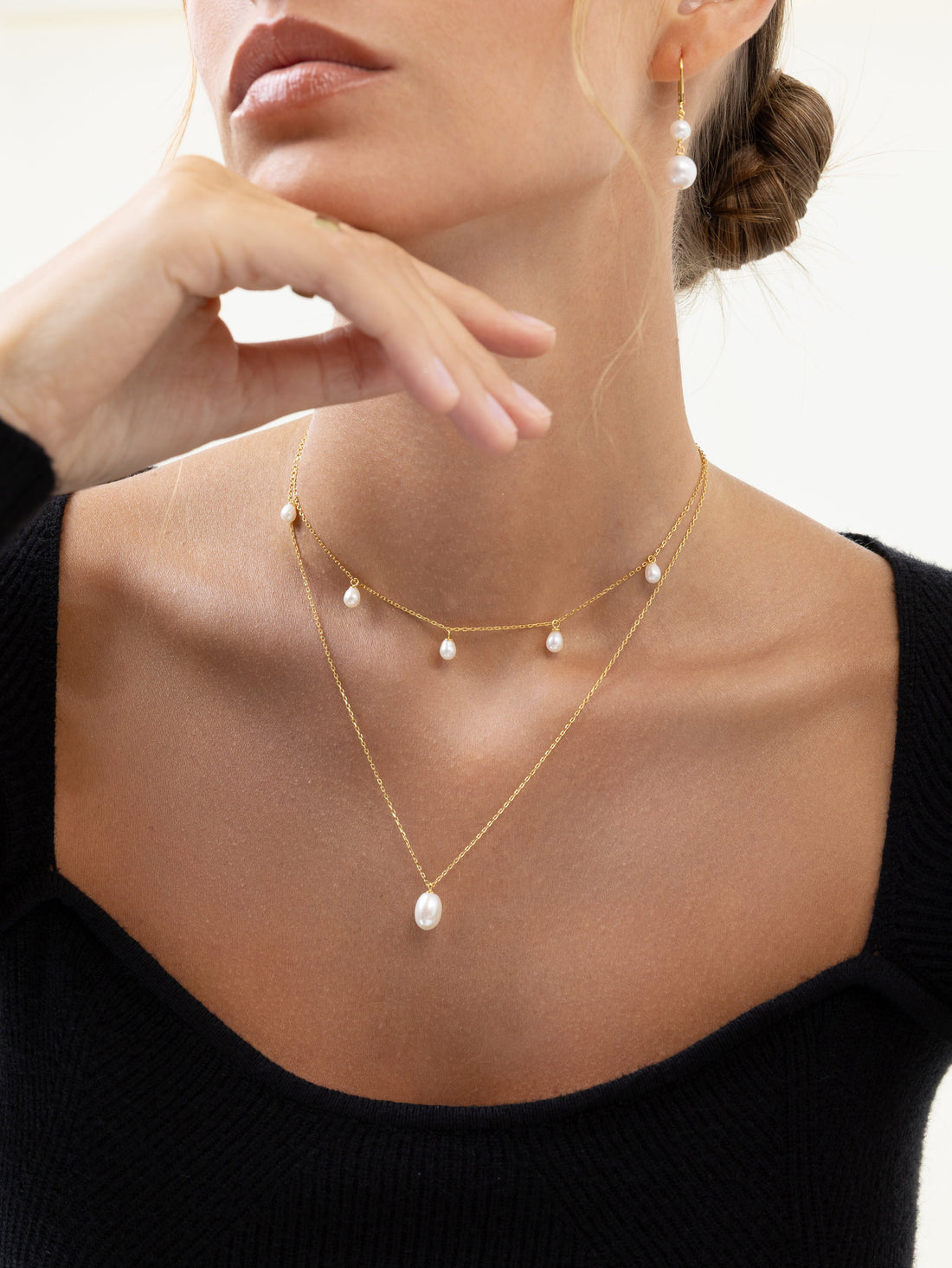 Model wearing Pearl Luna freshwater pearl jewelry in 18k gold-plated sterling silver