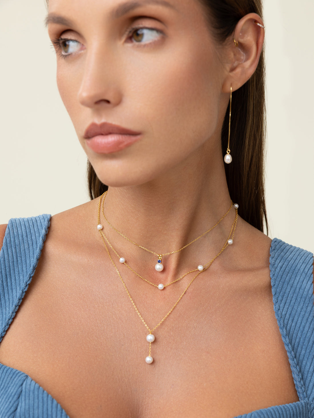 Model wearing Pearl Luna freshwater pearl jewelry — a travel-ready everyday look