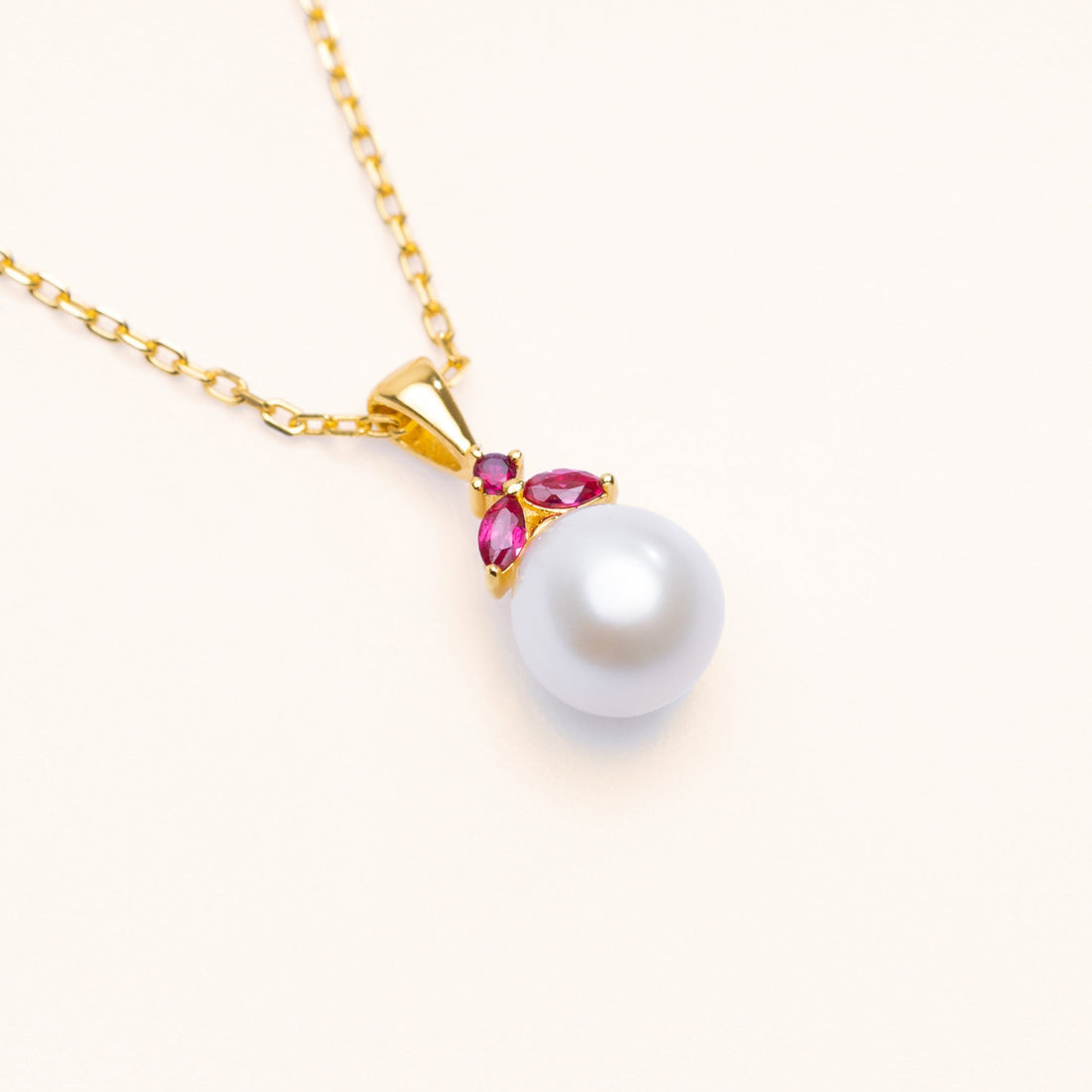 Pearlfruit freshwater pearl pendant with a red lab-grown ruby in sterling silver and 18k gold
