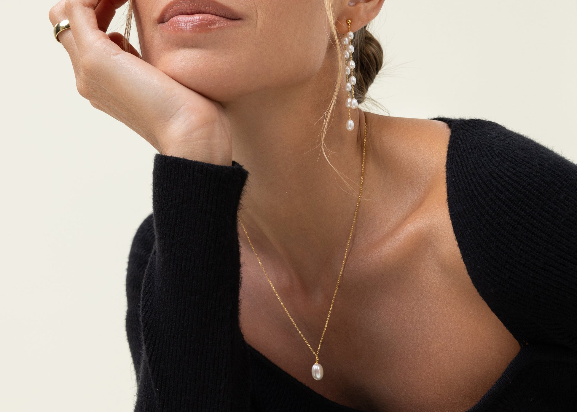 Classic pearl necklace with a large tear shaped pearl, on an adjustable gold chain